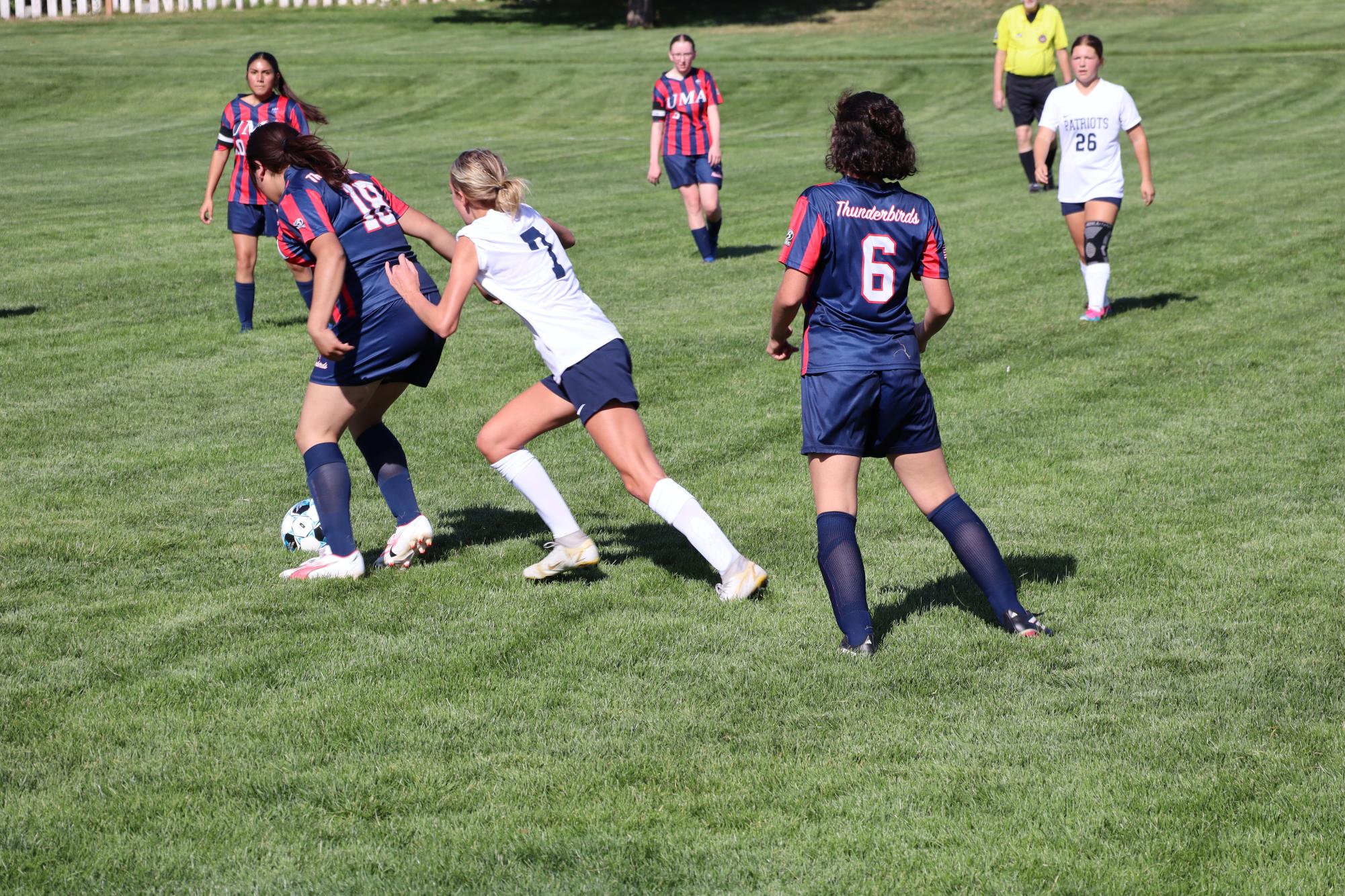 HS Girls Soccer face off in the field with a rival school.